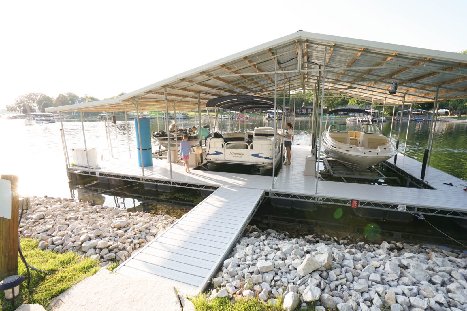 A dock with several boats parked on it.