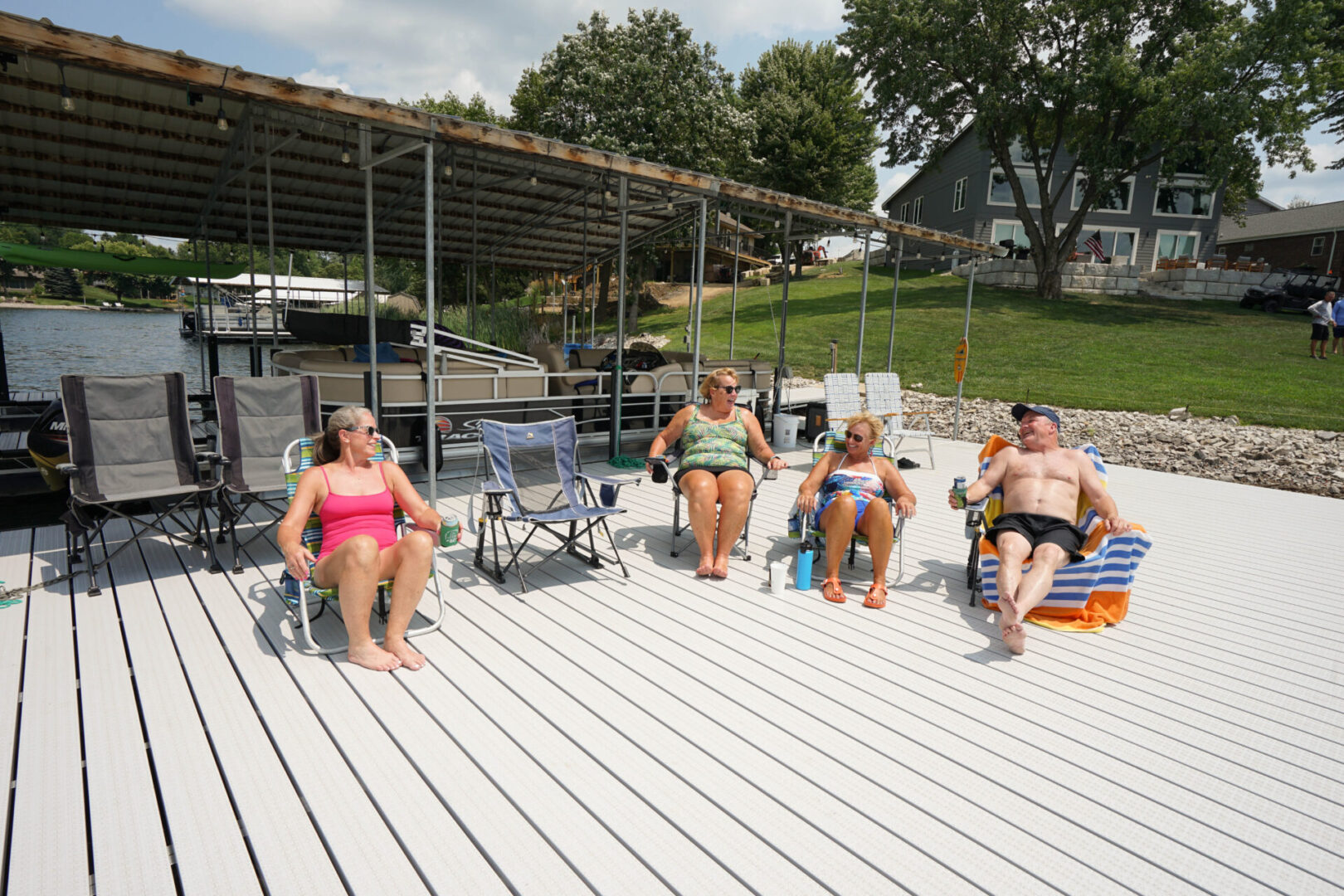 A group of people sitting on the deck