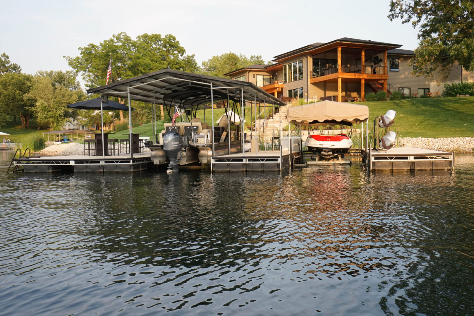 A boat dock with several boats parked on it.