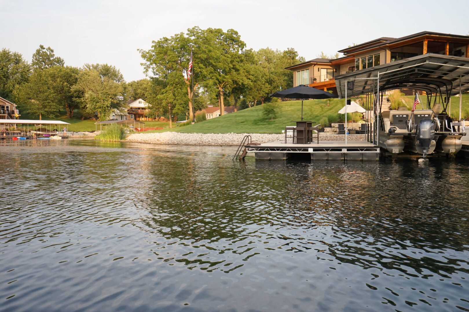 A dock with a house in the background