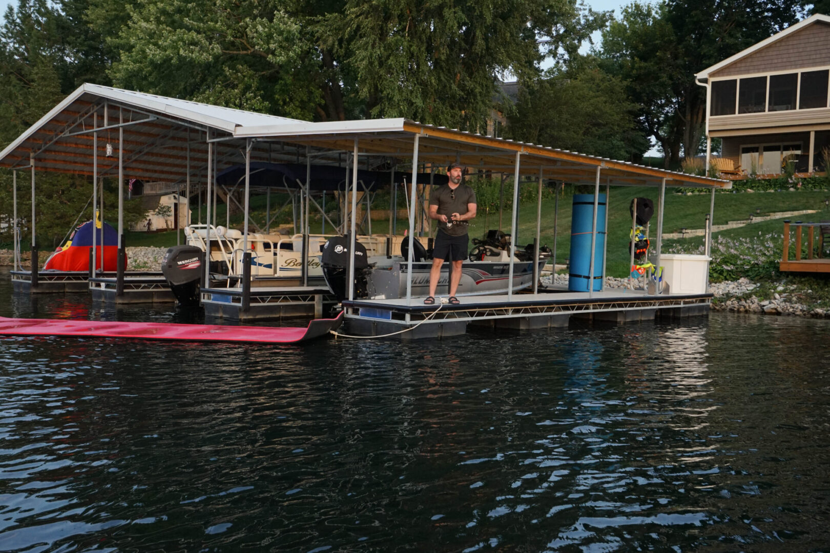 A man standing on the side of a boat.