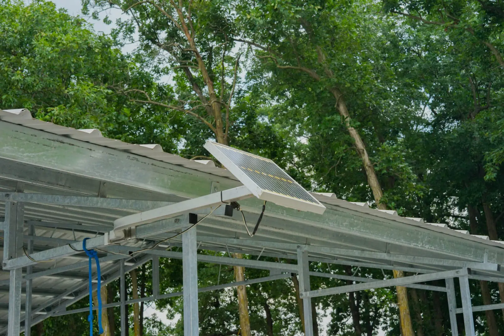 Solar panel mounted on metal shelter.