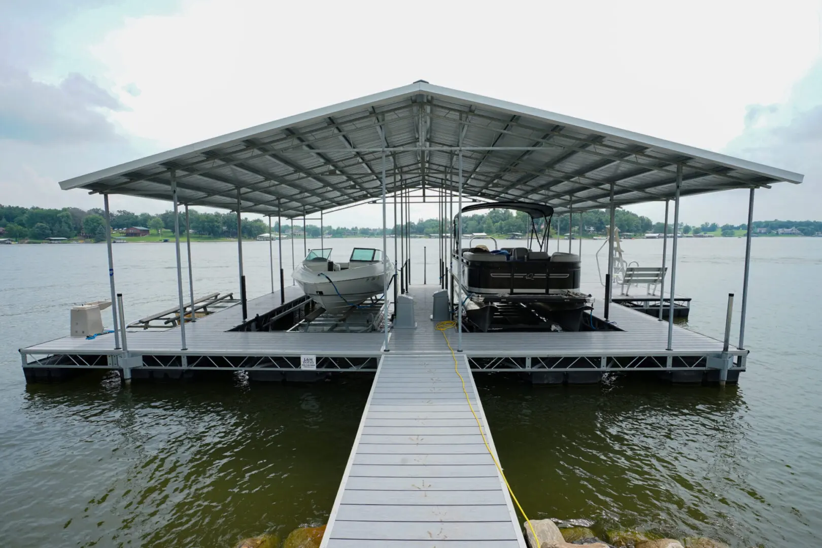 Covered boat dock with two boats.