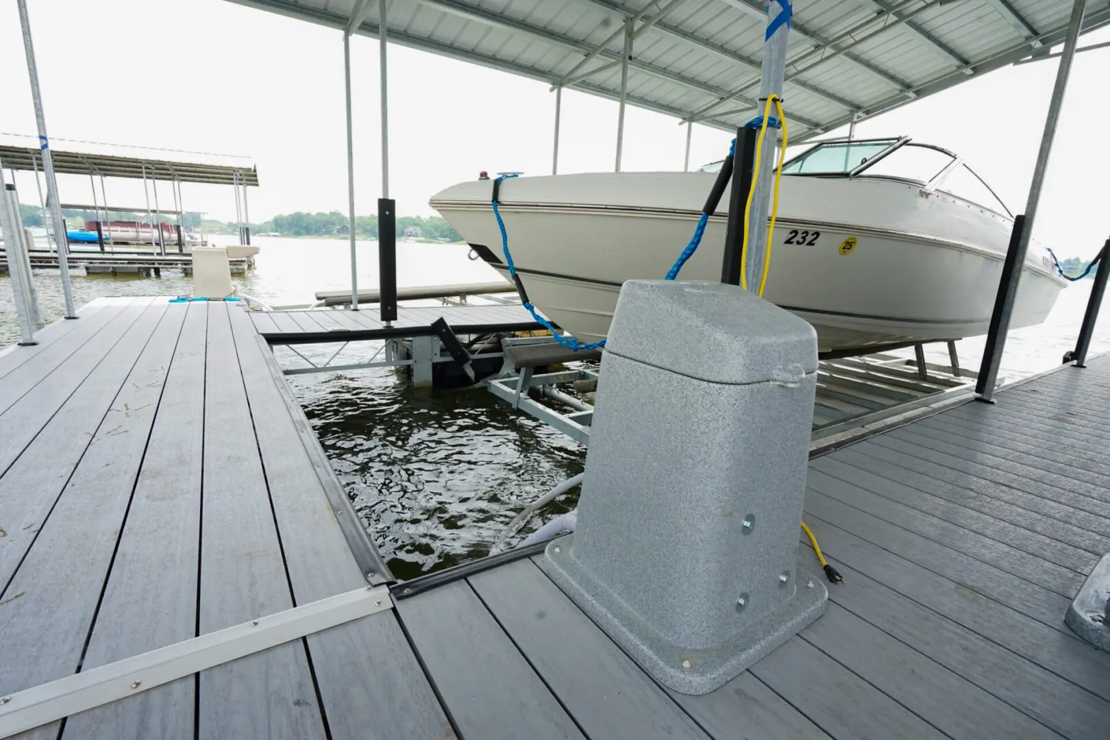 Boat lift in covered dock slip.