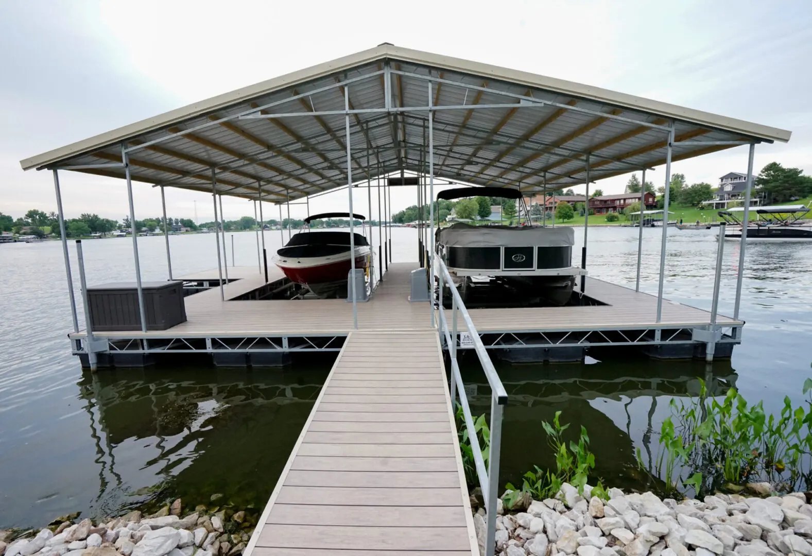 Covered boat dock with two boats.