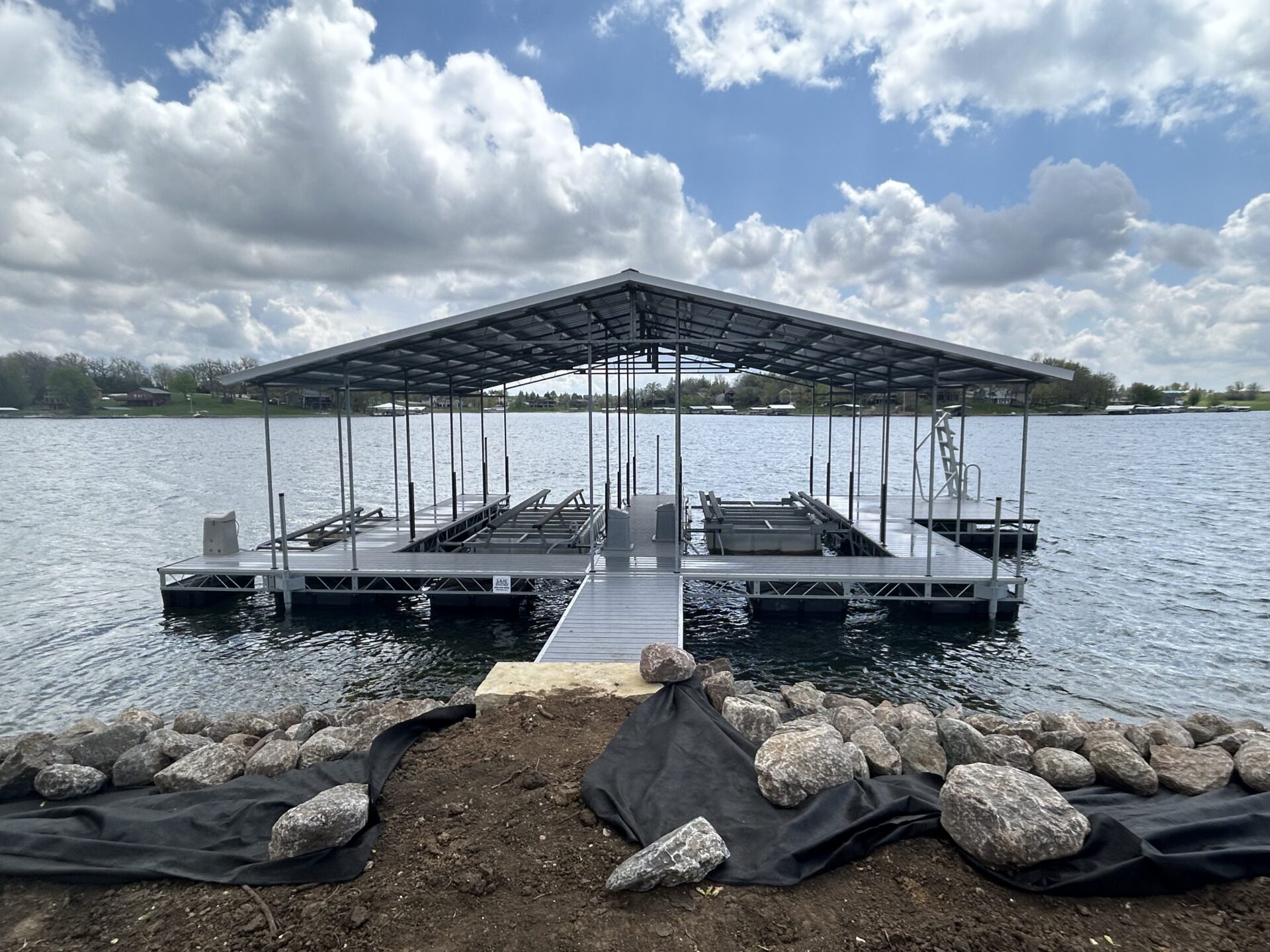 Covered boat dock on lake.