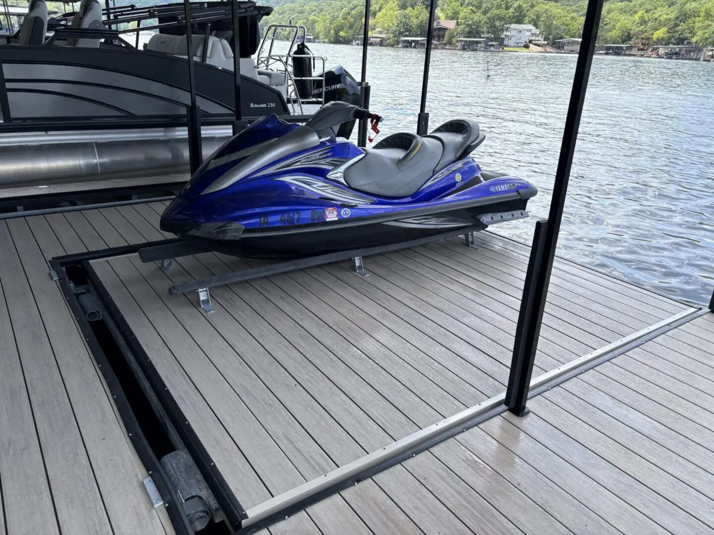 Blue Yamaha jet ski on dock.