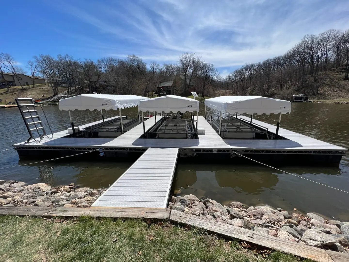 Floating dock with three covered slips.