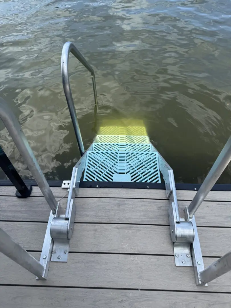 Here's an 8-word alt tag for the image: Dock ladder extending into lake water.